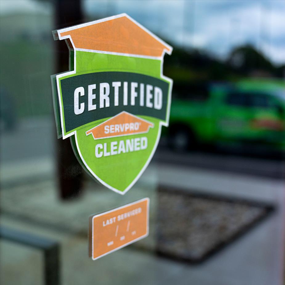 Certified: SERVPRO Cleaned window sticker with reflection