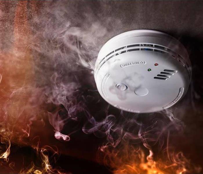 smoke and carbon monoxide detector sounds in a fire